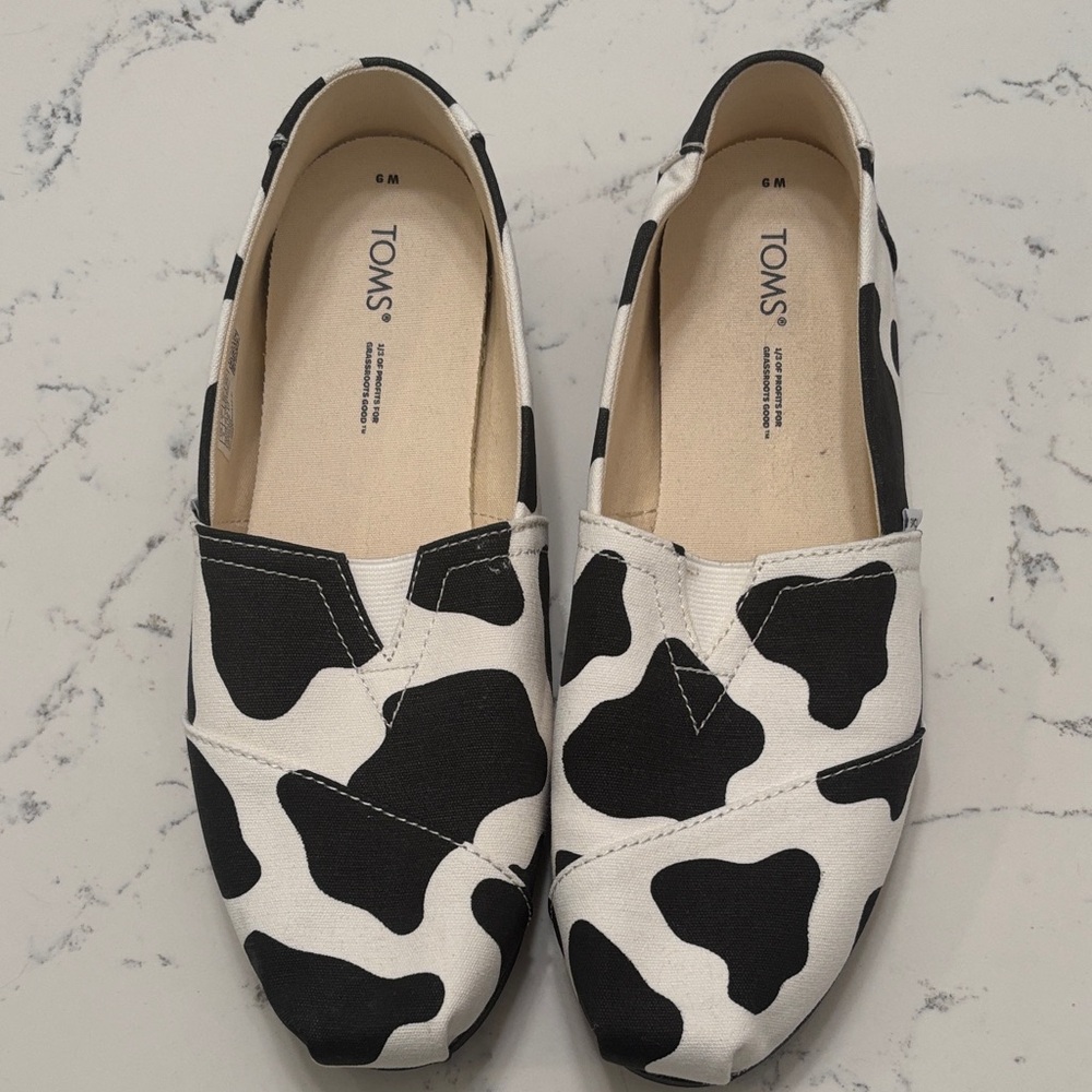 Toms Canvas Slip-On Flats in Black & White Cow Print